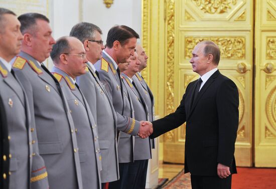 Russian President Vladimir Putin meets with senior officers and prosecutors in the Kremlin