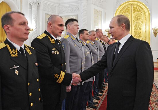 Russian President Vladimir Putin meets with senior officers and prosecutors in the Kremlin