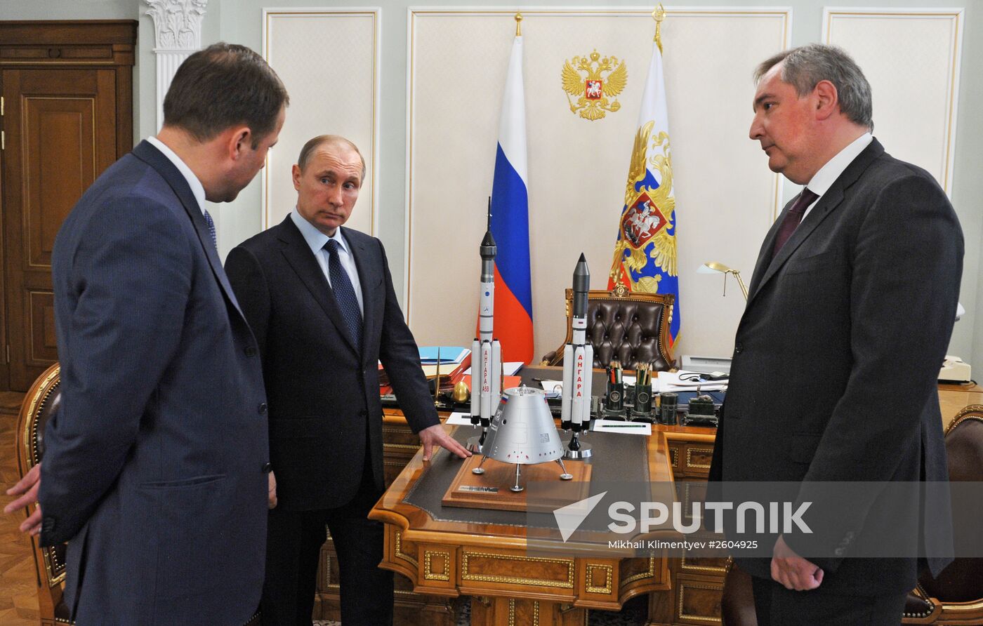 President Vladimir Putin meets with Deputy Prime Minister Dmitry Rogozin and Roscosmos Head Igor Komarov