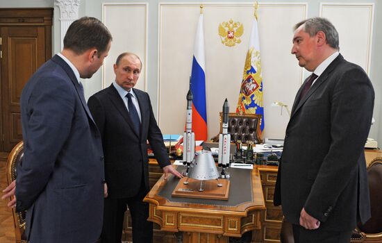 President Vladimir Putin meets with Deputy Prime Minister Dmitry Rogozin and Roscosmos Head Igor Komarov