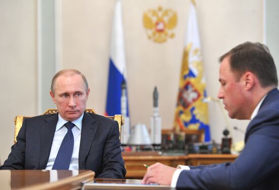 President Vladimir Putin meets with Deputy Prime Minister Dmitry Rogozin and Roscosmos Head Igor Komarov