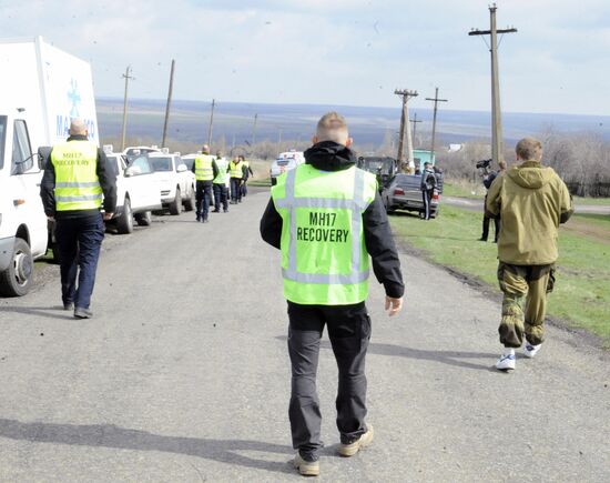 Dutch and Malaysian experts visit site of Malaysia Airlines flight MH17 plane crash