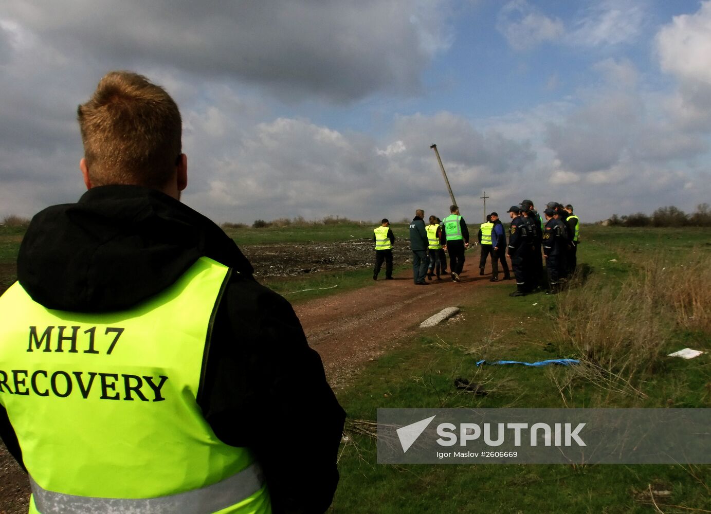 Dutch and Malaysian experts visit site of Malaysia Airlines flight MH17 plane crash