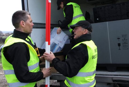 Dutch and Malaysian experts visit site of Malaysia Airlines flight MH17 plane crash