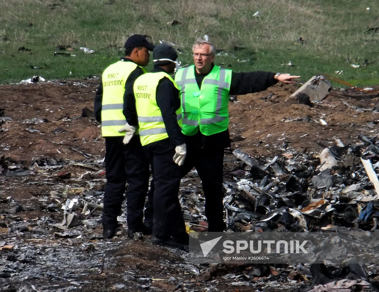Dutch and Malaysian experts visit site of Malaysia Airlines flight MH17 plane crash