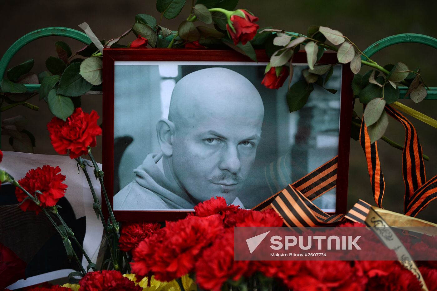 Flowers and candles by Ukrainian embassy in Moscow in memory of journalist Oles Buzina killed in Kiev