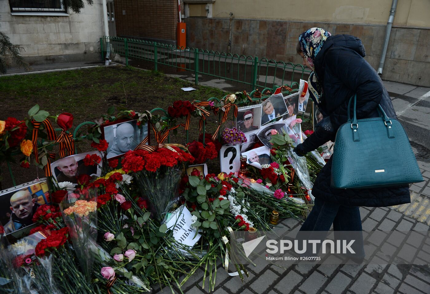 Flowers and candles by Ukrainian embassy in Moscow in memory of journalist Oles Buzina killed in Kiev