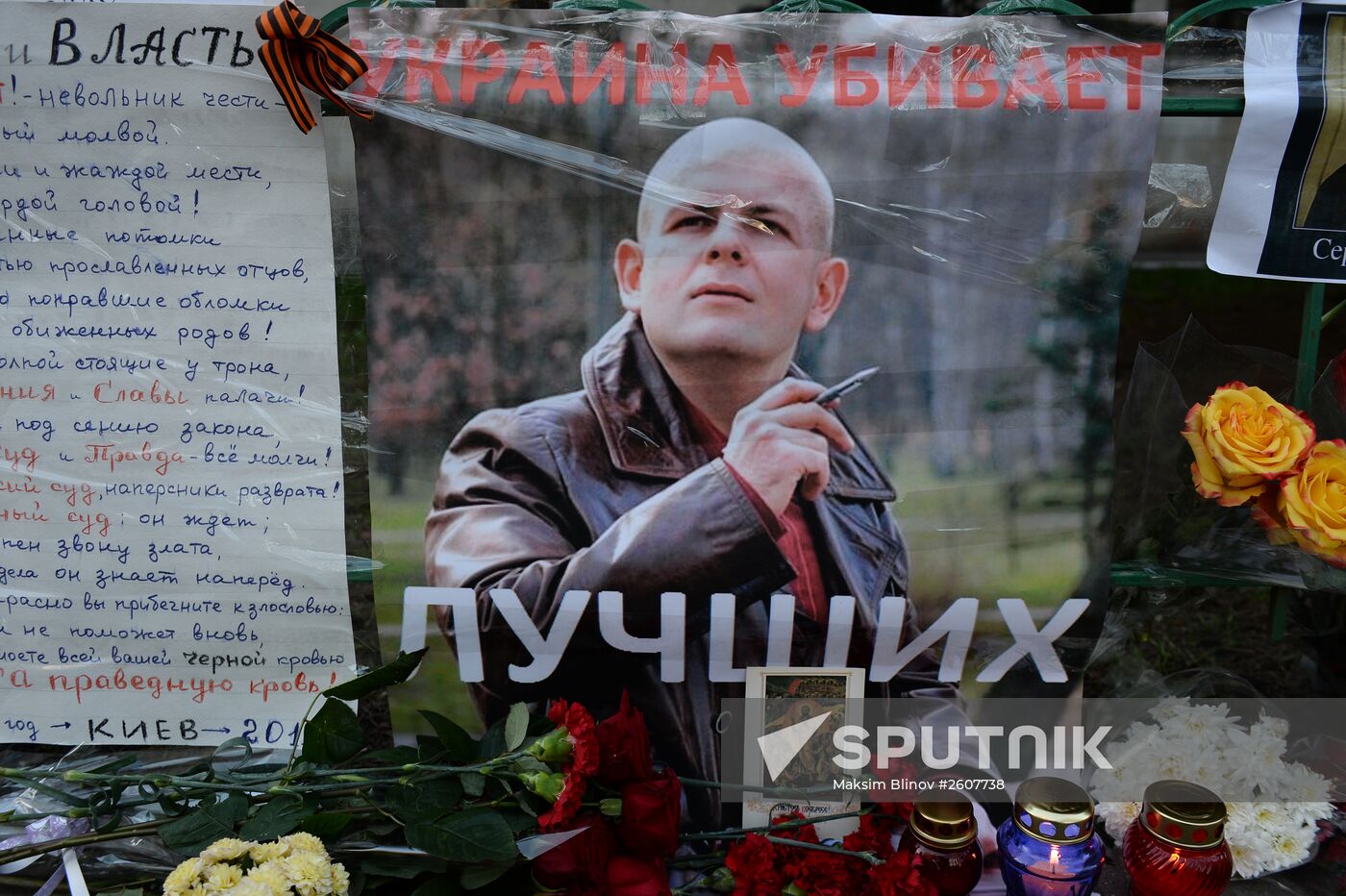 Flowers and candles by Ukrainian embassy in Moscow in memory of journalist Oles Buzina killed in Kiev