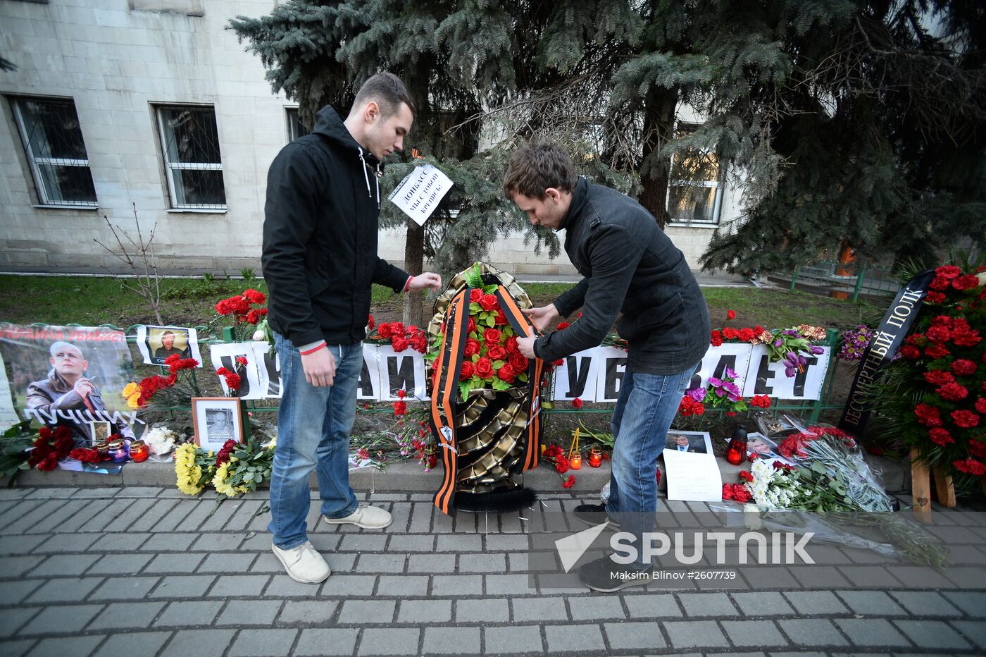 Flowers and candles by Ukrainian embassy in Moscow in memory of journalist Oles Buzina killed in Kiev