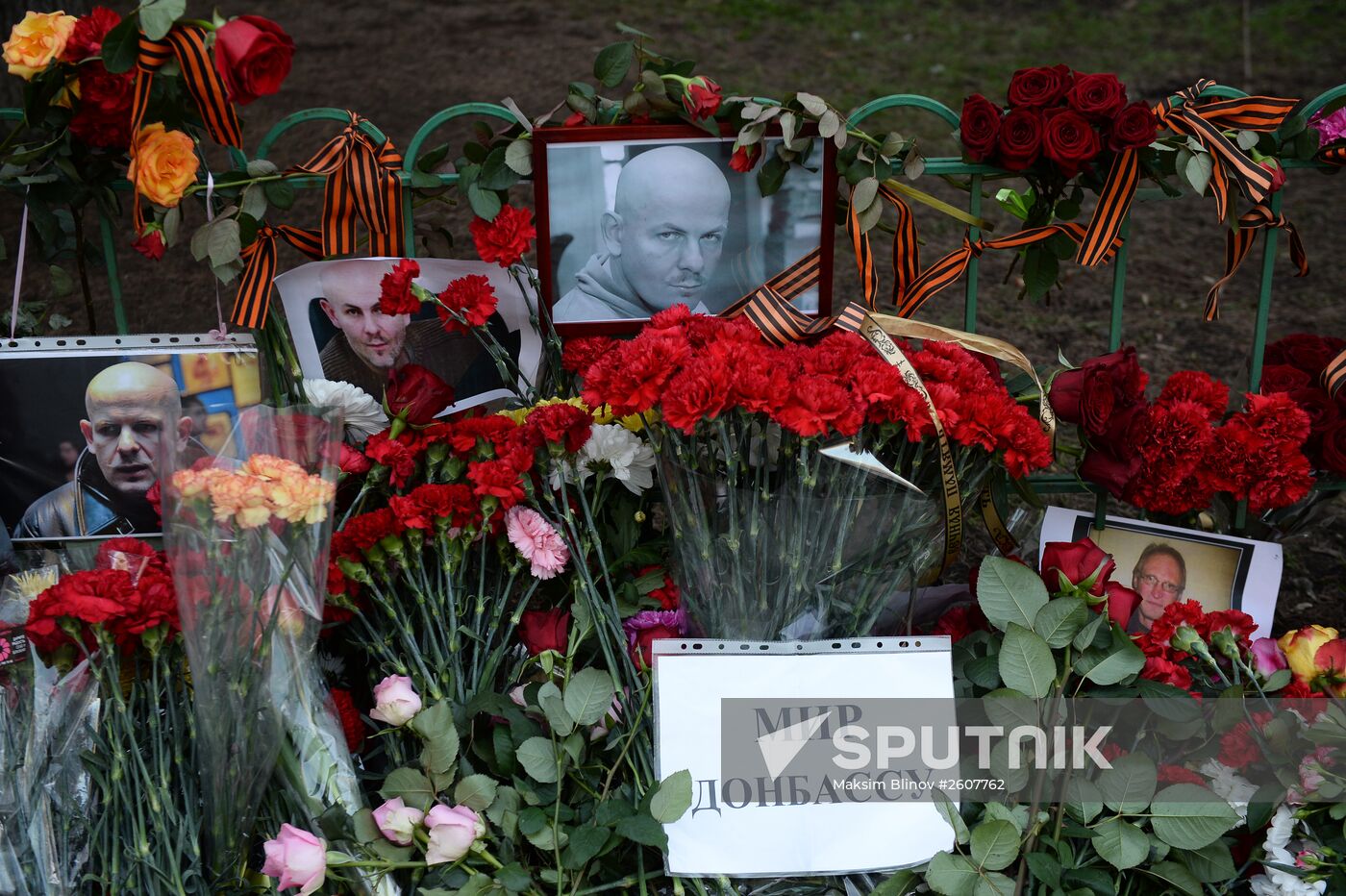 Flowers and candles by Ukrainian embassy in Moscow in memory of journalist Oles Buzina killed in Kiev