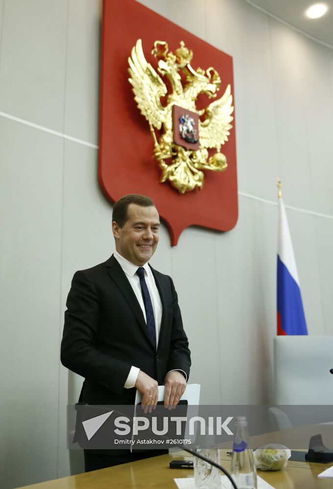 Prime Minister Dmitry Medvedev (left) at the State Duma, on delivering a government performance report for 2014, April 21, 2015. Location: Russia, Moscow. Author: Dmitry Astakhov/Sputnik. Dmitry Medvedev reports on the Government's performance at the State Duma of the Russian Federation