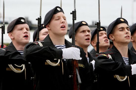 Lighting a torch at the Pacific Fleet's Combat Glory memorial in Vladivostok