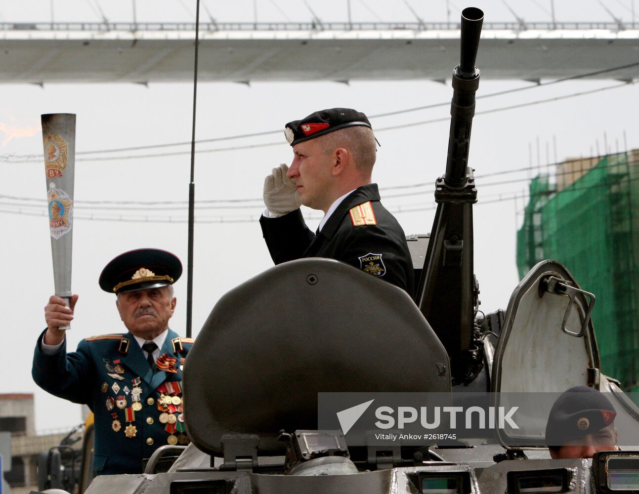 Lighting a torch at the Pacific Fleet's Combat Glory memorial in Vladivostok