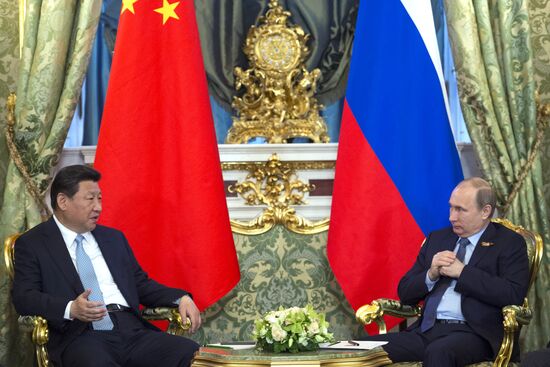 Russian President Vladimir Putin meets with Chinese President Xi Jinping