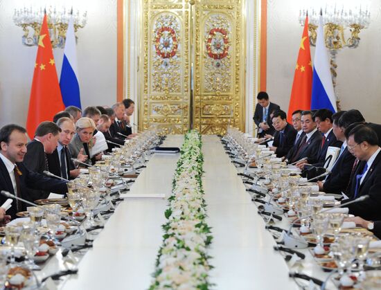 Russian President Vladimir Putin meets with Chinese President Xi Jinping