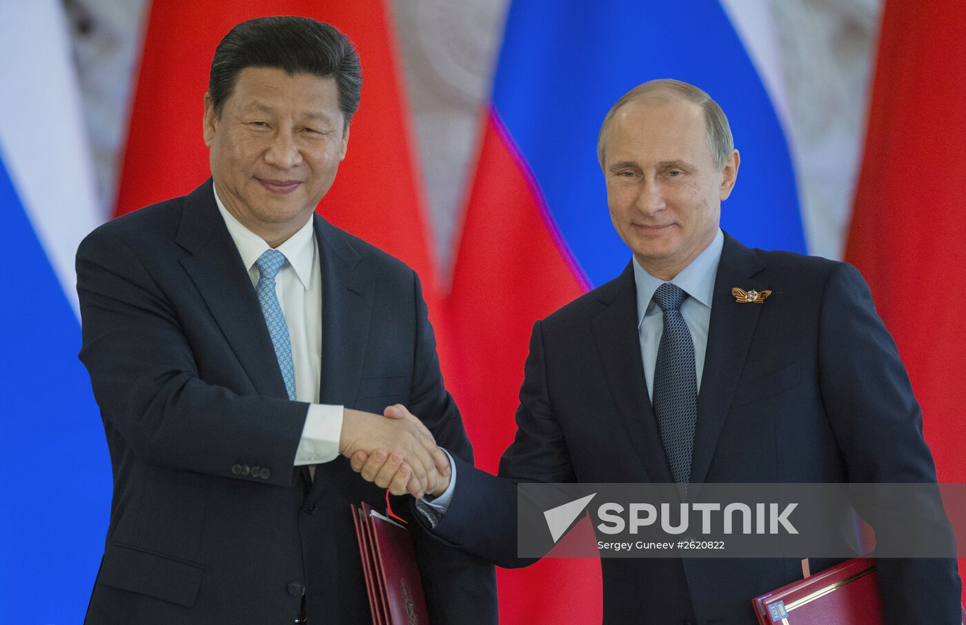Russian President Vladimir Putin meets with Chinese President Xi Jinping