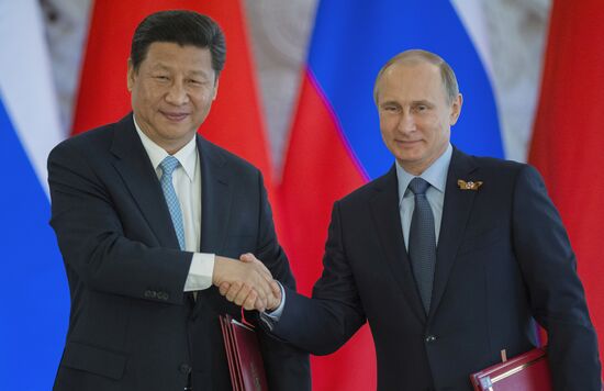 Russian President Vladimir Putin meets with Chinese President Xi Jinping