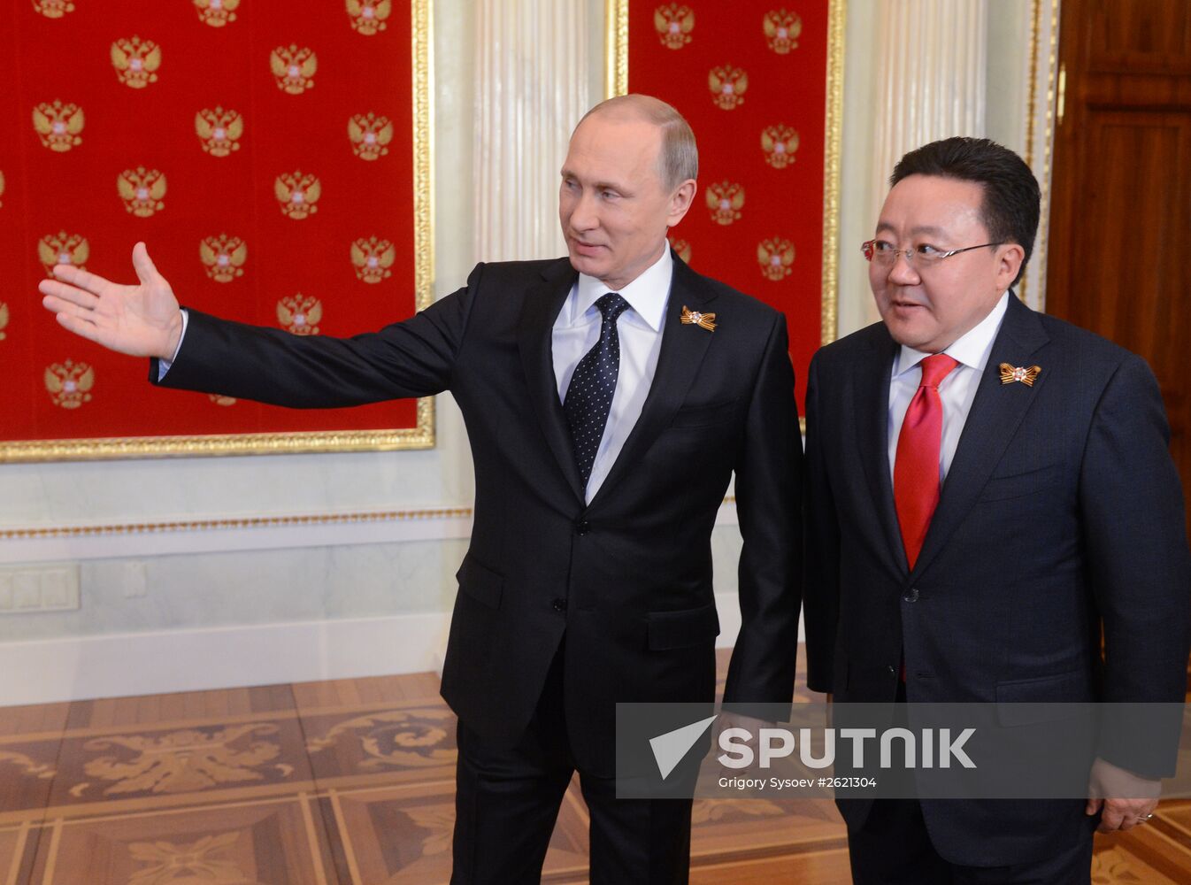 Russian President Vladimir Putin welcomes foreign delegation heads and honorary guests