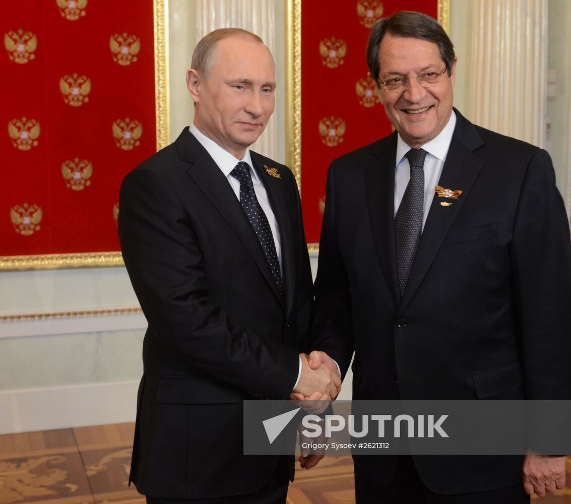 Russian President Vladimir Putin welcomes foreign delegation heads and honorary guests
