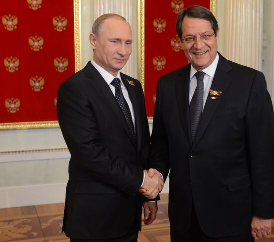 Russian President Vladimir Putin welcomes foreign delegation heads and honorary guests