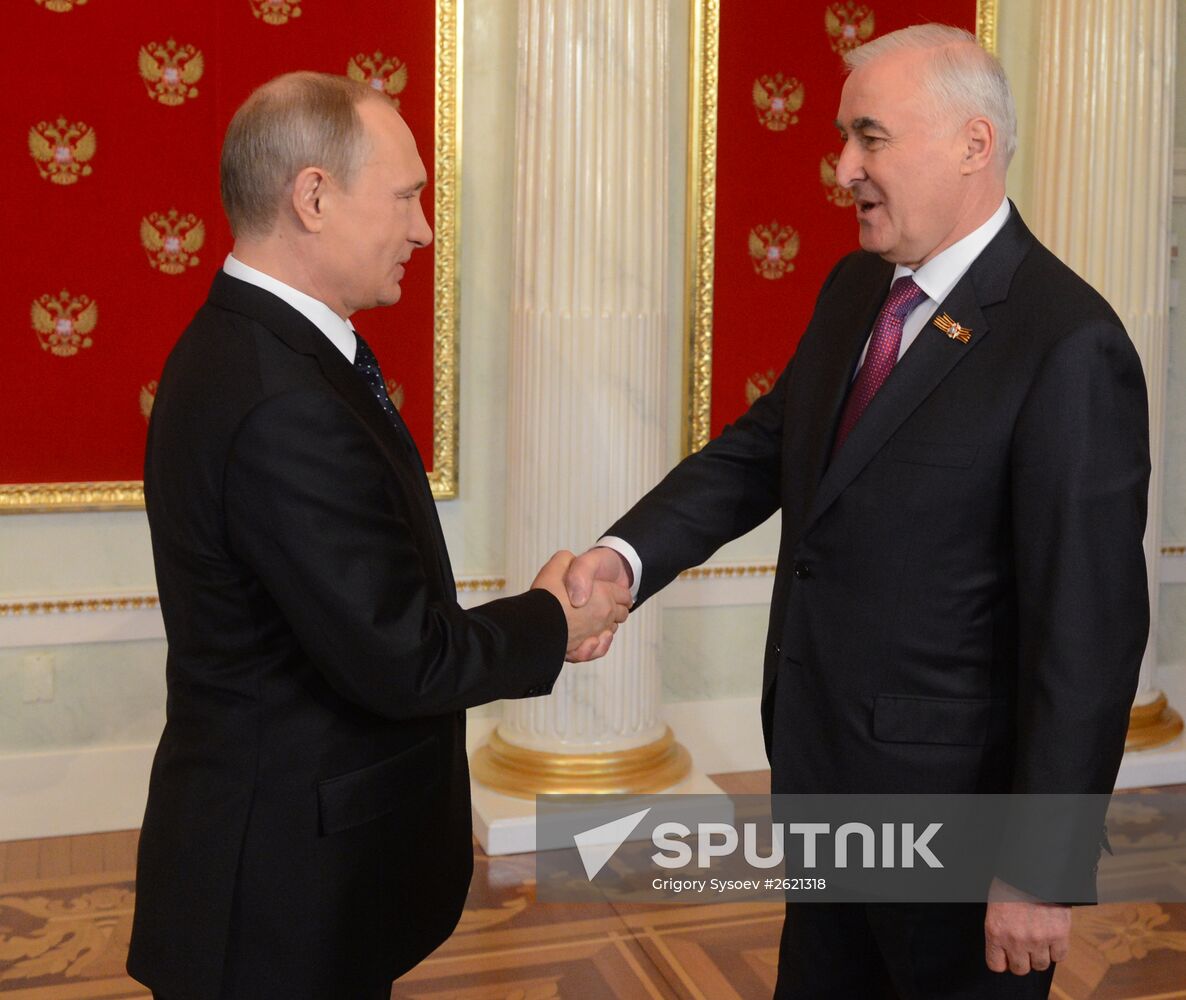 Russian President Vladimir Putin welcomes foreign delegation heads and honorary guests