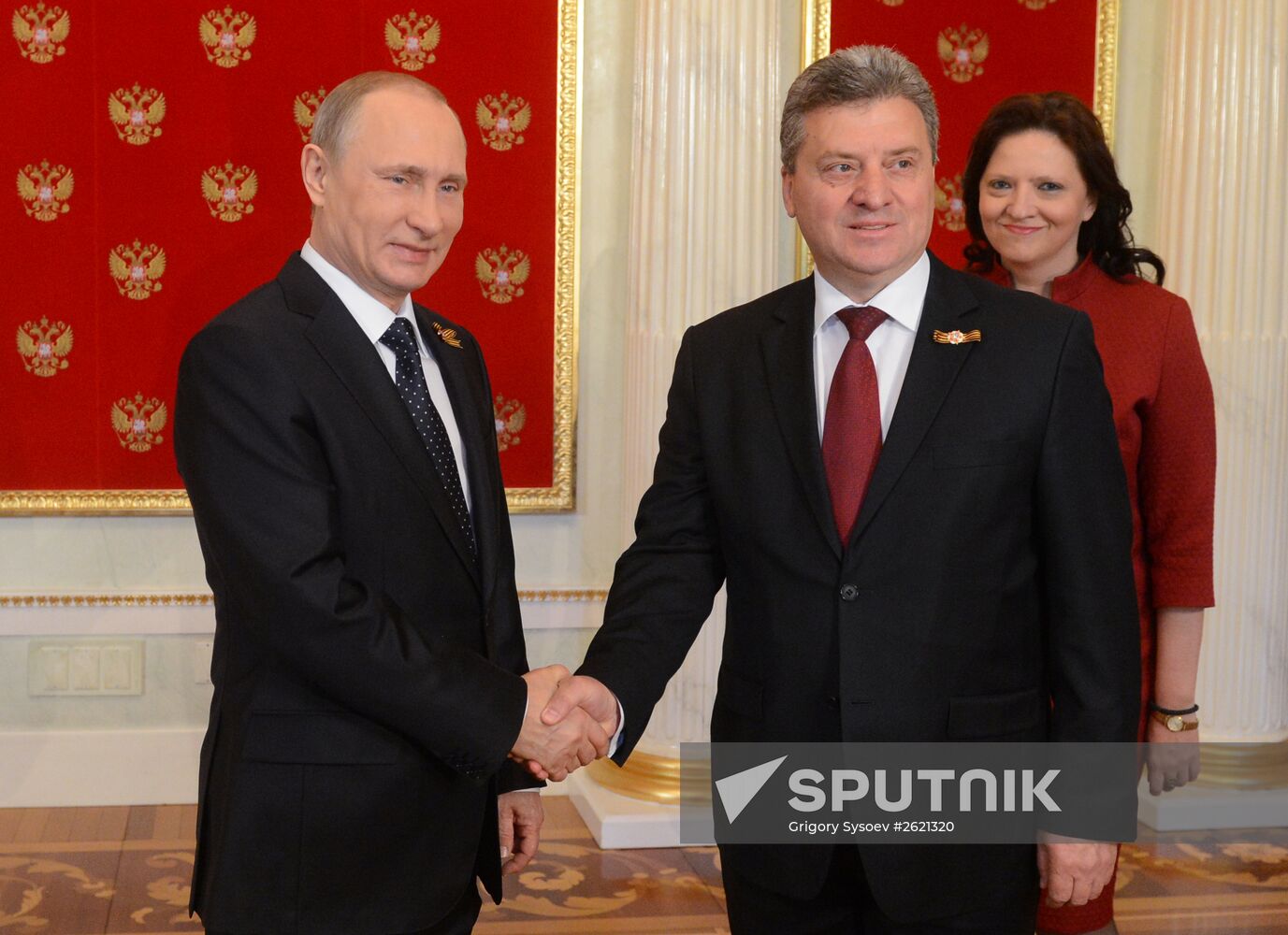 Russian President Vladimir Putin welcomes foreign delegation heads and honorary guests