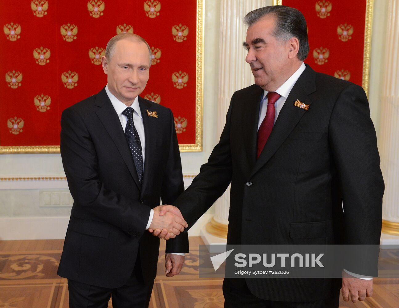 Russian President Vladimir Putin welcomes foreign delegation heads and honorary guests