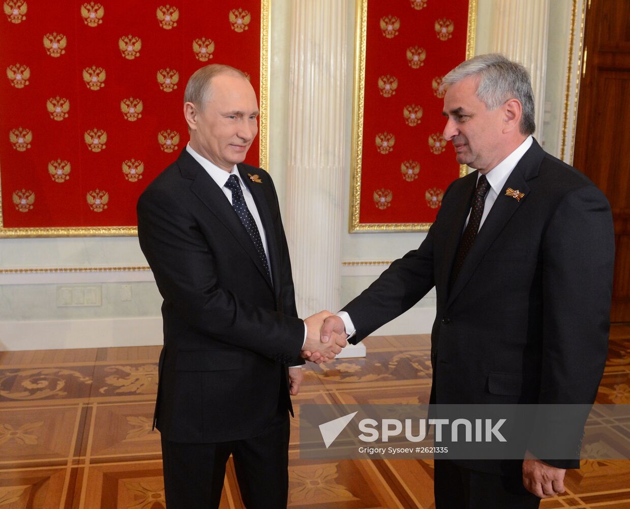 Russian President Vladimir Putin welcomes foreign delegation heads and honorary guests