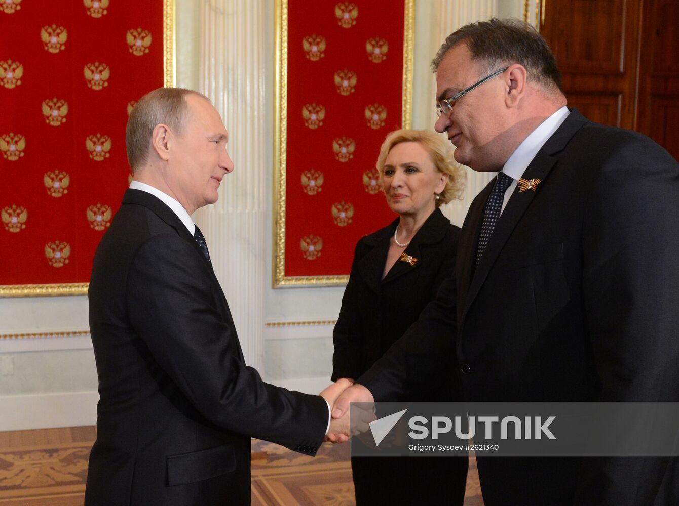 Russian President Vladimir Putin welcomes foreign delegation heads and honorary guests