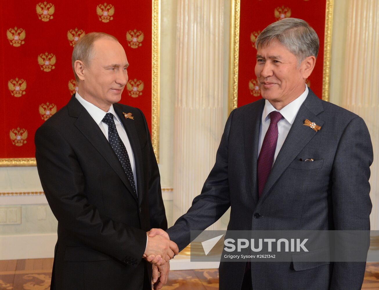 Russian President Vladimir Putin welcomes foreign delegation heads and honorary guests