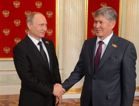 Russian President Vladimir Putin welcomes foreign delegation heads and honorary guests