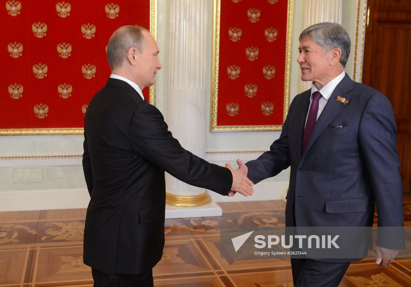 Russian President Vladimir Putin welcomes foreign delegation heads and honorary guests
