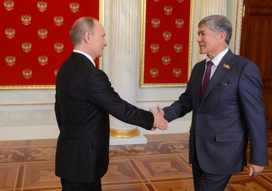 Russian President Vladimir Putin welcomes foreign delegation heads and honorary guests