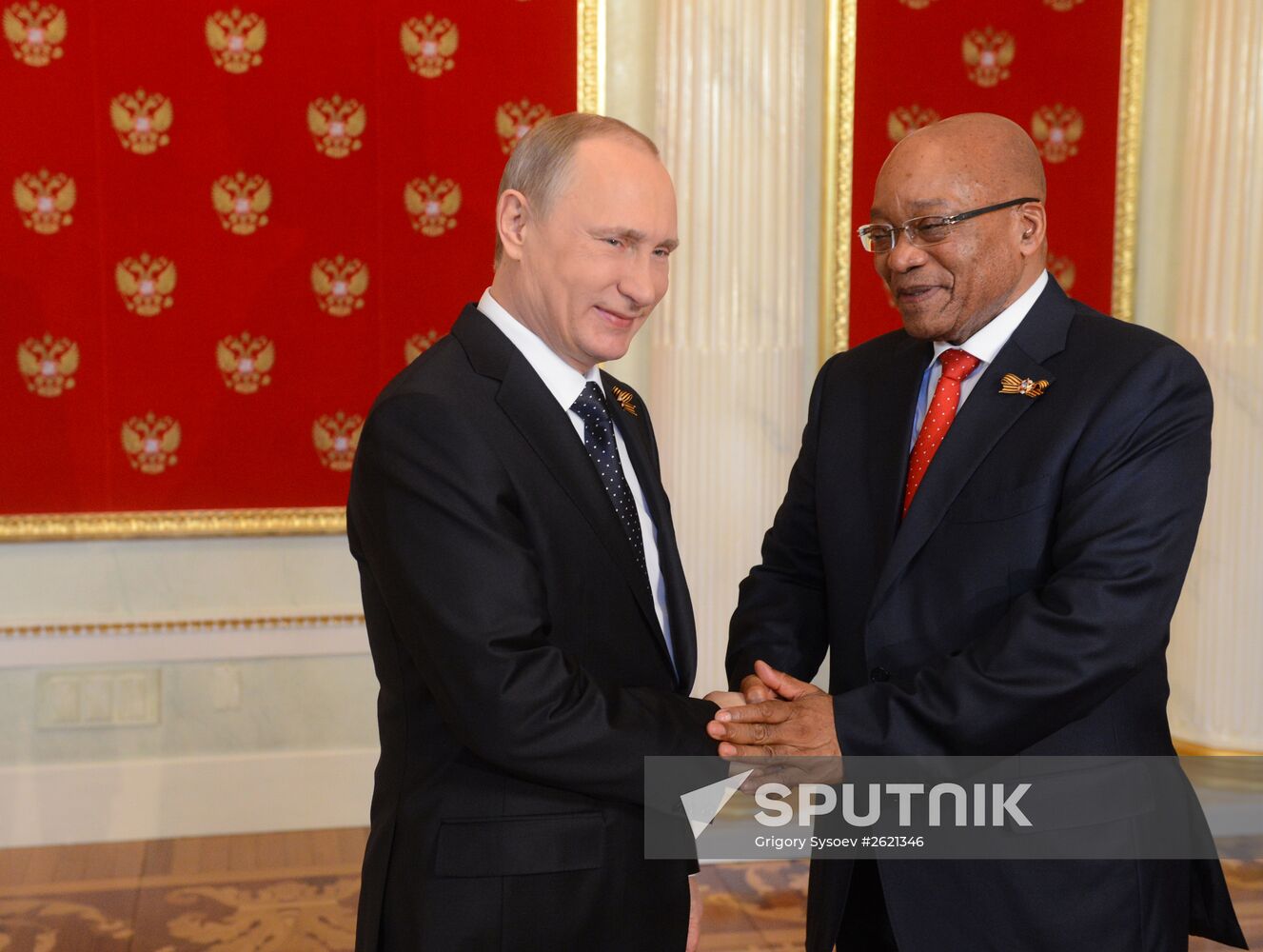 Russian President Vladimir Putin welcomes foreign delegation heads and honorary guests