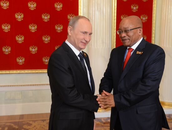 Russian President Vladimir Putin welcomes foreign delegation heads and honorary guests