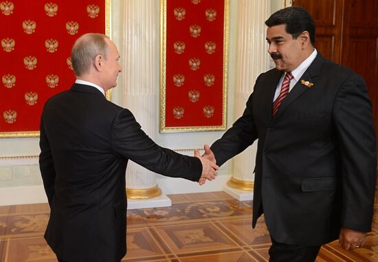 Russian President Vladimir Putin welcomes foreign delegation heads and honorary guests