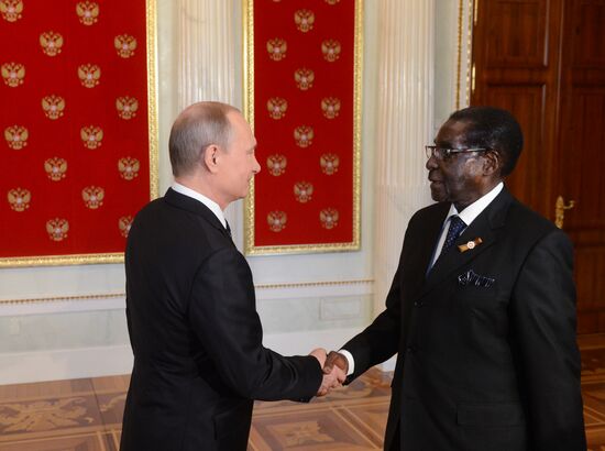 Russian President Vladimir Putin welcomes foreign delegation heads and honorary guests