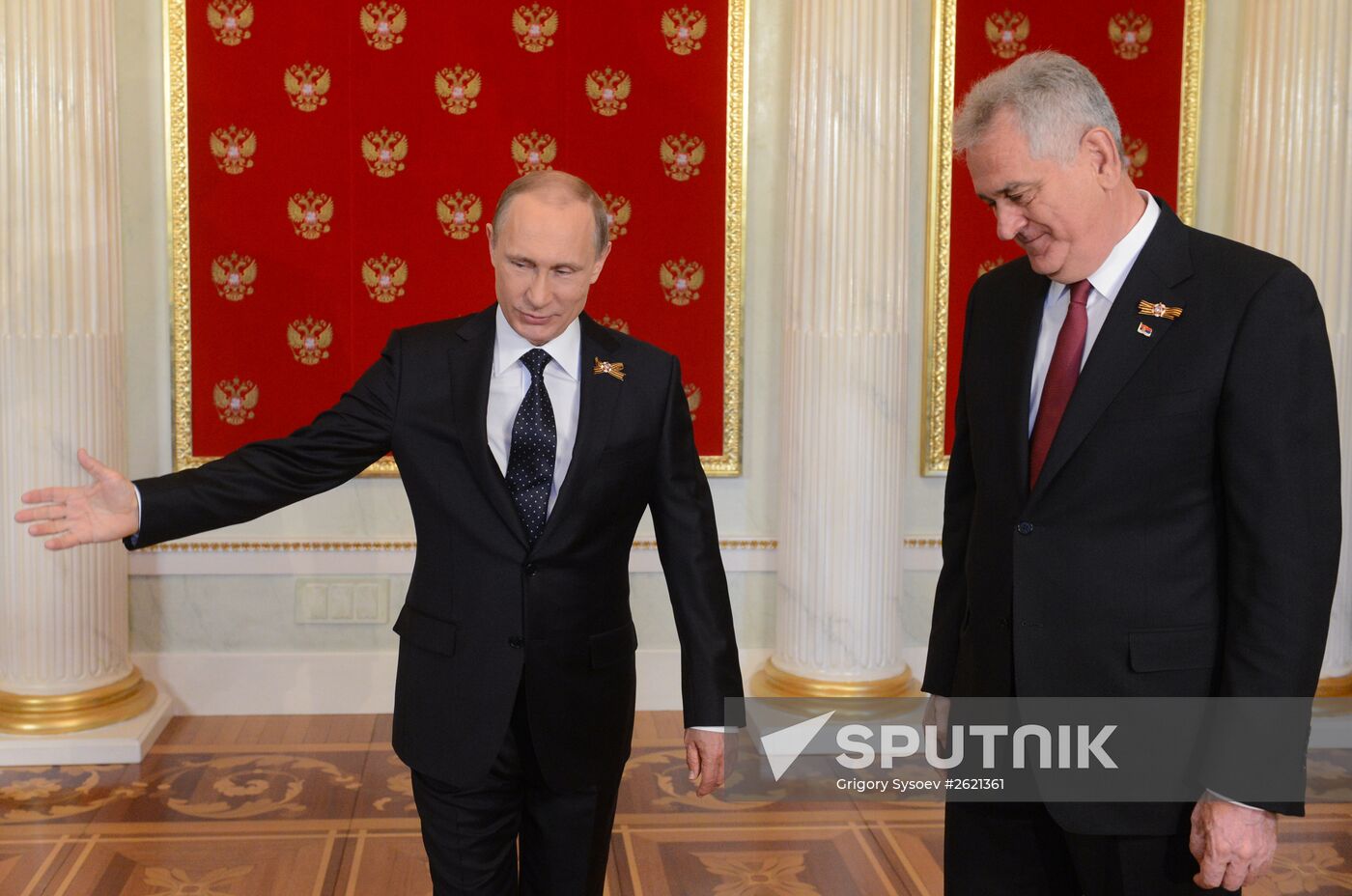 Russian President Vladimir Putin welcomes foreign delegation heads and honorary guests