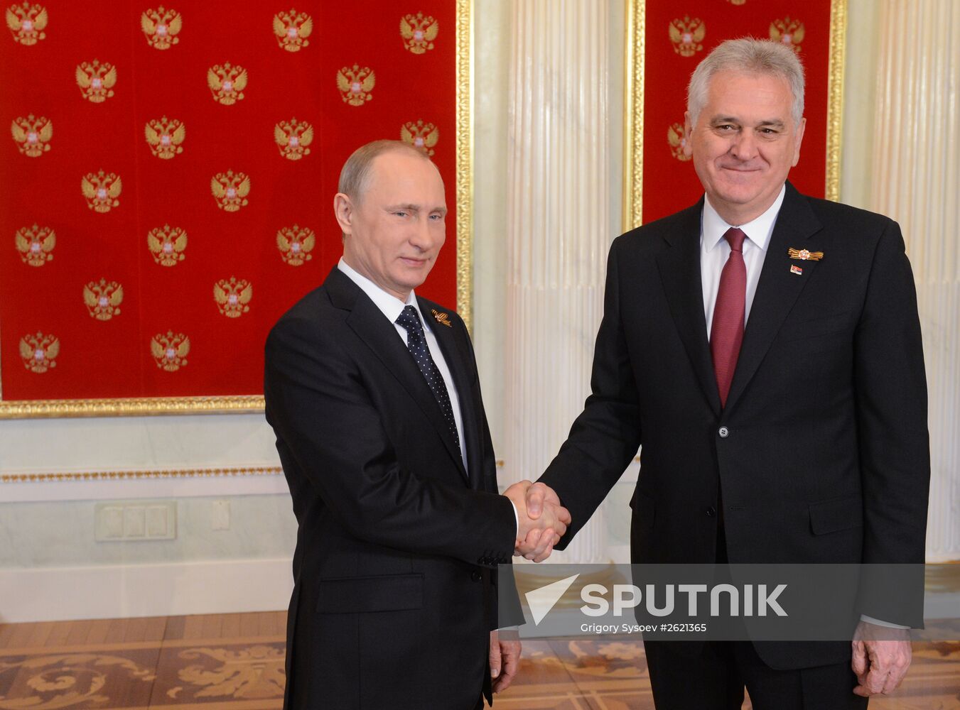 Russian President Vladimir Putin welcomes foreign delegation heads and honorary guests