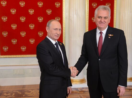 Russian President Vladimir Putin welcomes foreign delegation heads and honorary guests