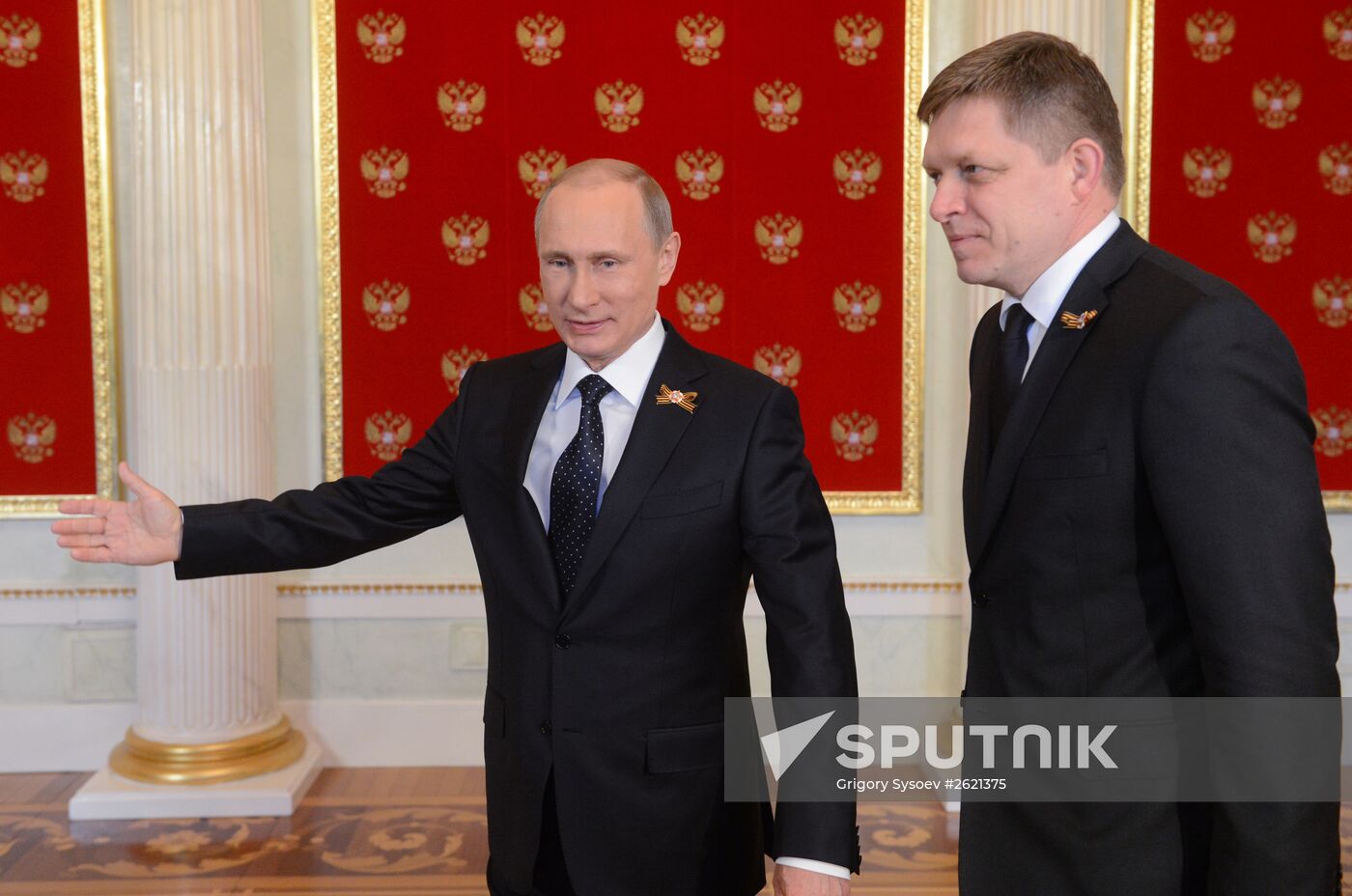 Russian President Vladimir Putin welcomes foreign delegation heads and honorary guests