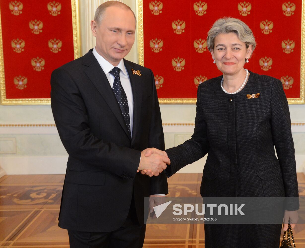 Russian President Vladimir Putin welcomes foreign delegation heads and honorary guests