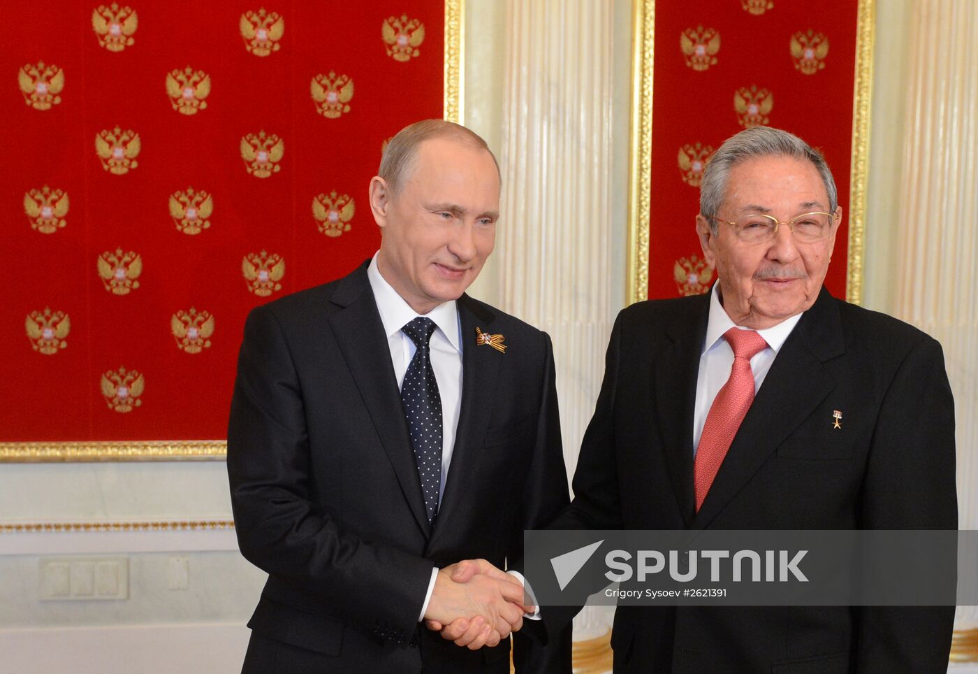 Russian President Vladimir Putin welcomes foreign delegation heads and honorary guests