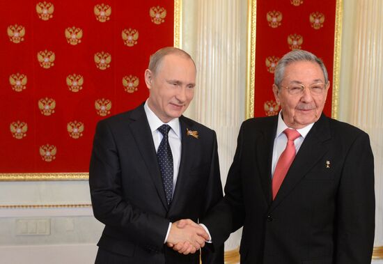 Russian President Vladimir Putin welcomes foreign delegation heads and honorary guests
