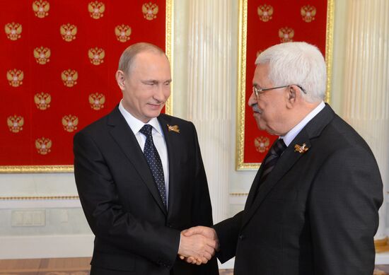 Russian President Vladimir Putin welcomes foreign delegation heads and honorary guests