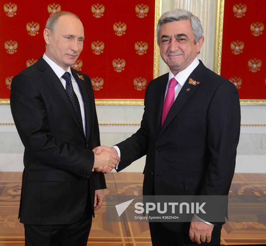 Russian President Vladimir Putin welcomes foreign delegation heads and honorary guests