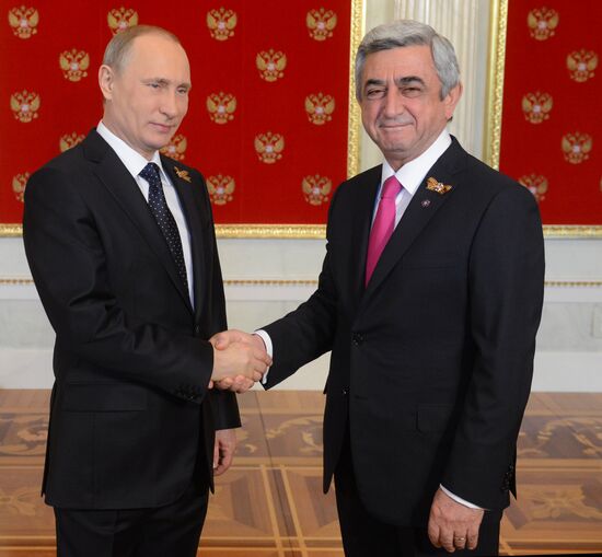 Russian President Vladimir Putin welcomes foreign delegation heads and honorary guests