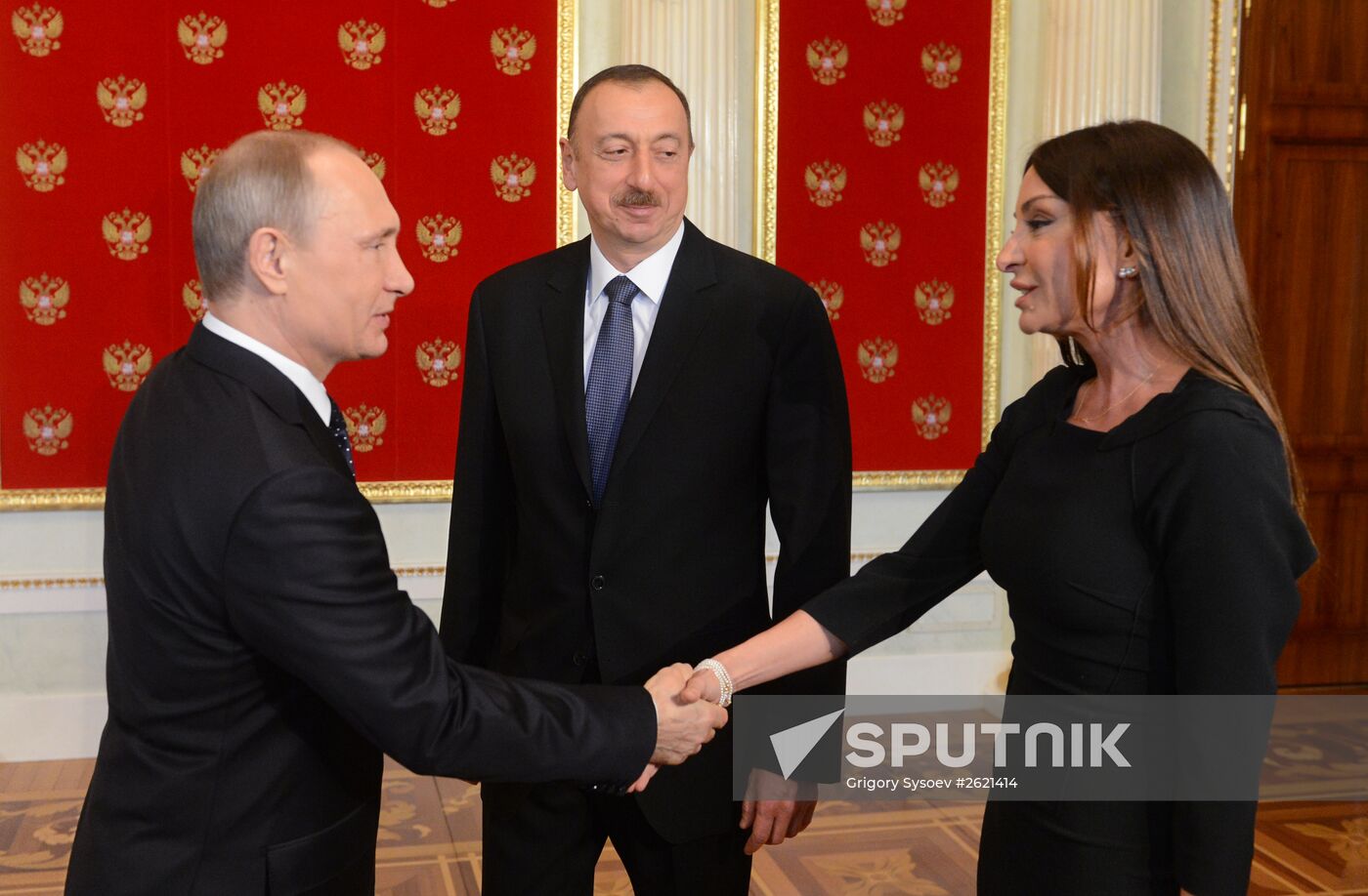 Russian President Vladimir Putin welcomes foreign delegation heads and honorary guests