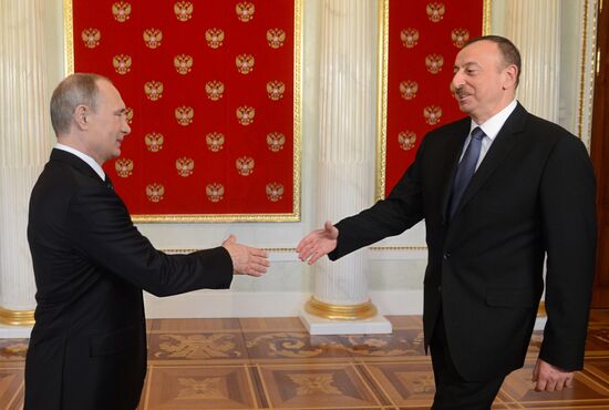 Russian President Vladimir Putin welcomes foreign delegation heads and honorary guests