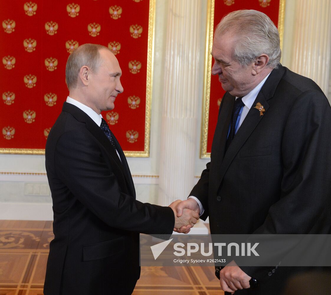 Russian President Vladimir Putin welcomes foreign delegation heads and honorary guests